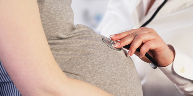 Doctor examining a pregnant woman