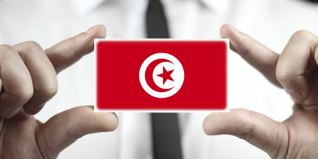 Businessman holding a business card with Tunisia Flag