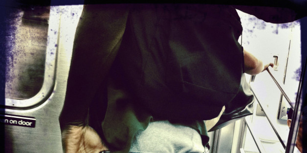 Boy with baggy pants on subway.