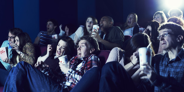Audience enjoying movie at the cinema