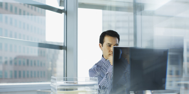 Businessman working at desk in office