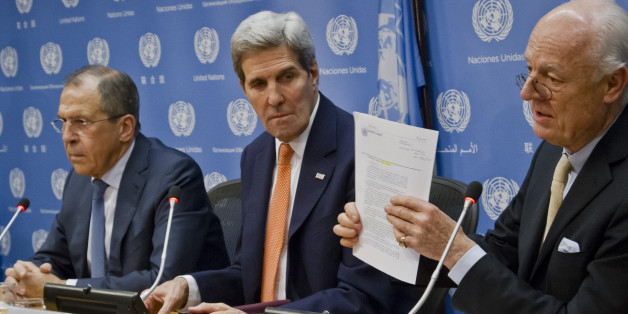 U.N. Special Envoy for Syria Staffan de Mistura, right, shows a copy of a Security Council resolution concerning Syria, during a press conference with Russian Foreign Minister Sergey Lavrov, left, and U.S. Secretary of State John Kerry, center, Friday, Dec. 18, 2015 at U.N. headquarters. The resolution was approved on vote during a meeting in the U.N. Security Council of foreign ministers. (AP Photo/Bebeto Matthews)