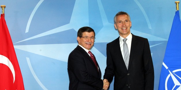 BRUSSELS, BELGIUM - NOVEMBER 30: Turkey's Prime Minister Ahmet Davutoglu (L) and Secretary General of NATO Jens Stoltenberg (R) shake hands during their meeting in Brussels, Belgium on November 30, 2015. (Photo by Hakan Goktepe/Anadolu Agency/Getty Images)