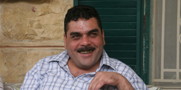 Samir Kuntar greets visitors on July 19, 2008, at his family home in Aabey, Lebanon. Kuntar spent nearly 30 years in an Israeli prison before being released on July 16, 2008, in a deal with Hezbollah. (Photo by Dion Nissenbaum/MCT/MCT via Getty Images)