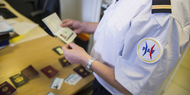 French Office of False Documents and Identity Fraud's, Laurent Gauthier, displays a false passport during an interview with The Associated Press in Paris, Wednesday, June 10, 2015. Police, immigration specialists and hi-tech experts from 16 countries are seeking ways to tackle the growing problem of identity and document fraud that feeds the movement of terrorists across borders, social welfare scams and preys on refugees seeking a safe haven in the West. (AP Photo/Kamil Zihnioglu)
