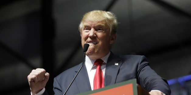 Republican presidential candidate, businessman Donald Trump addresses supporters at a campaign rally, Monday, Dec. 21, 2015, in Grand Rapids, Mich. (AP Photo/Carlos Osorio)