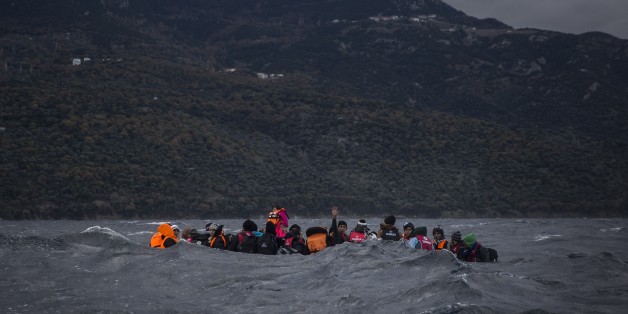 Refugees and migrants on a dinghy approaching the Greek island of Lesbos on Thursday, Dec. 17, 2015. According to the International Organization for Migration, more than 920,000 people have entered the EU so far this year. The influx has overwhelmed national border guards and reception capacities, notably in Greece, where some 770,000 migrants have arrived, most of them from Turkey. (AP Photo/Santi Palacios)
