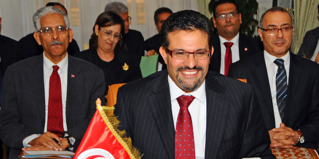 Tunisian Foreign Minister Rafik Abdessalem attends a meeting with his Egyptian and Libyan counterparts, in Tunis, Tunisia, Friday March 16, 2012. (AP Photo/Hassene Dridi)