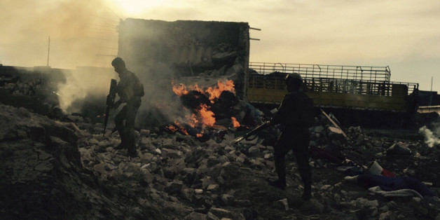 Iraqi security forces enter heavy damaged downtown Ramadi, 70 miles (115 kilometers) west of Baghdad, Iraq, Sunday, Dec. 27, 2015. Islamic State fighters are putting up a tough fight in the militant-held city of Ramadi, slowing down the advance of Iraqi forces, Gen. Ismail al-Mahlawi, head of the Anbar military operations, said Sunday. (AP Photo/Rwa Faisal)