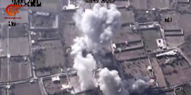 This image made from video made available on Saturday, Dec. 26, 2015, by Al-Mayadeen, government-controlled Syrian Television, which has been verified and is consistent with other AP reporting shows, drone footage allegedly showing Syrian army airstrikes targeting Zahran Allouch, the head of the Army of Islam group near Damascus, Syria. Militant groups in Syria on Saturday mourned the death of a powerful rebel commander who was killed in an airstrike near Damascus â a high profile assass