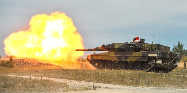 A Royal Danish Army Leopard 2 tank fires at a target during a live-fire exercise at the 7th Army Joint Multinational Training Command's Grafenwoehr Training Area, Germany, July 04, 2014. The 7th Army JMTC provides dynamic training, preparing forces to execute Unified Land Operations and contingencies in support of the Combatant Commands, NATO, and other national requirements.
(U.S. Army photo by Visual Information Specialist Markus Rauchenberger/released)