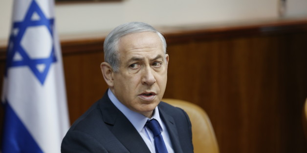 Israel's Prime Minister Benjamin Netanyahu, center, speaks during the weekly cabinet meeting in Jerusalem, Sunday, Dec. 13, 2015. (Baz Ratner/Pool Photo via AP)