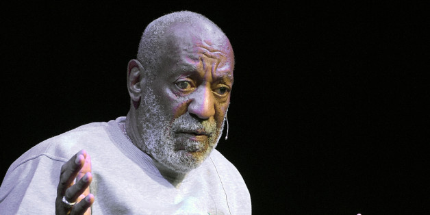 FILE - In this Friday, Nov. 21, 2014, file photo, comedian Bill Cosby performs at the Maxwell C. King Center for the Performing Arts, in Melbourne, Fla. Lawyers for Cosby say they will fight an attempt to require the comedianâs wife to give a sworn deposition in a defamation lawsuit filed by seven women who have accused Cosby of sexually assaulting them decades ago. A lawyer for the women has subpoenaed Camille Cosby to be deposed on Jan. 6, 2016, at a Springfield hotel. (AP Photo/Phelan M. Ebenhack, File)