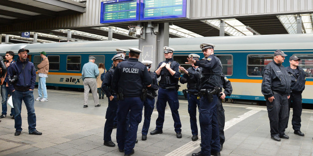 Police wait for the arrival of refugees at the main train station in Munich, Germany, Monday, Sept. 7, 2015. Refugees arrived in various trains to get first registration as asylum seekers in Germany. (AP Photo/ Kerstin Joensson)