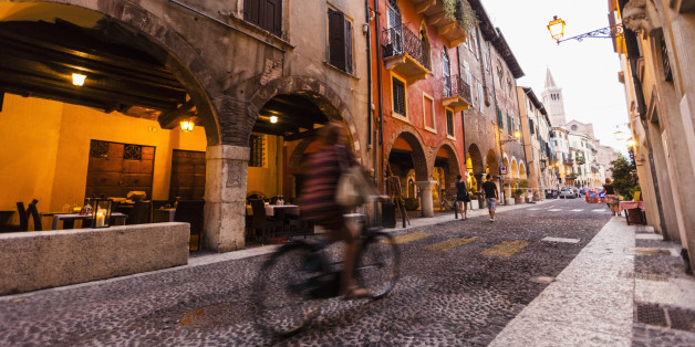 Cyclist in the historic center, Verona, Veneto, Italy