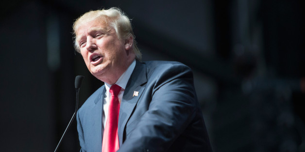 GRAND RAPIDS, MI - DECEMBER 21: Republican presidential candidate Donald Trump speaks to guests at a campaign rally on December 21, 2015 in Grand Rapids, Michigan. The full-house event was repeatedly interrupted by protestors. Trump continues to lead the most polls in the race for the Republican nomination for president. (Photo by Scott Olson/Getty Images)