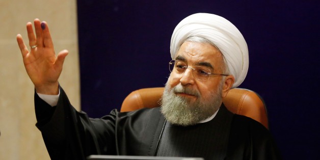 Iranian President Hassan Rouhani addresses a press conference after registering his candidacy for the upcoming Assembly of Experts elections at the interior ministry in Tehran on December 21, 2015. The 86-member Assembly's role is to monitor the work of the supreme leader, currently Ayatollah Ali Khamenei. The poll will coincide in February 2016 with parliamentary elections, which could see more moderates and reformists chosen on the back of Iran's recent nuclear deal with world powers. AFP PHOTO / ATTA KENARE / AFP / ATTA KENARE (Photo credit should read ATTA KENARE/AFP/Getty Images)