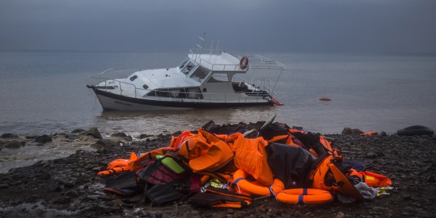 Life Jackets and a boat used by refugees and migrants to cross a part of the Aegean sea from Turkey to the Greek island of Lesbos remain on a beach, Thursday, Nov. 26, 2015. About 5,000 migrants reaching Europe each day over the so-called Balkan migrant route. The refugee crisis is stoking tensions among the countries on the so-called Balkan migrant corridor â Greece, Macedonia, Serbia, Croatia and Slovenia. (AP Photo/Santi Palacios)