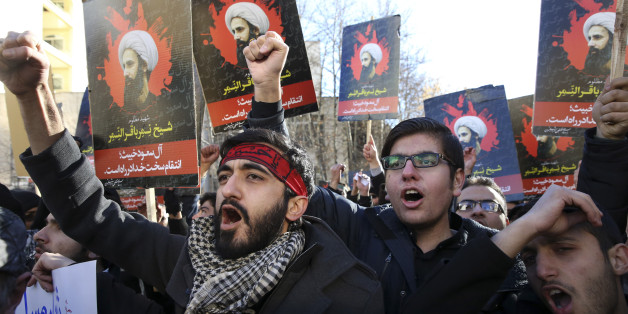 Iranian demonstrators chant slogans during a protest against the execution of Sheikh Nimr al-Nimr, shown in posters, a prominent opposition Shiite cleric in Saudi Arabia, in front of the Saudi Embassy, in Tehran, Sunday, Jan. 3, 2016. Saudi Arabia announced the execution of al-Nimr on Saturday along with 46 others. Al-Nimr was a central figure in protests by Saudi Arabia's Shiite minority until his arrest in 2012, and his execution drew condemnation from Shiites across the region. (AP Photo/Vahi