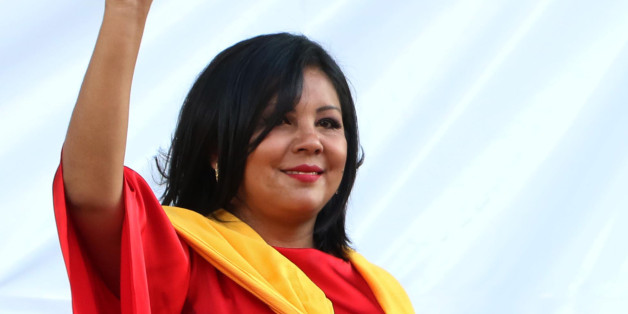 In this Friday, Jan. 1, 2016 photo, Gisela Mota waves during her swearing in ceremony as mayor of Temixco, Morelos State, Mexico. The Morelos state Public Security Commission says attackers invaded Mota's house on Saturday morning and killed her. (AP Photo/Tony Rivera)