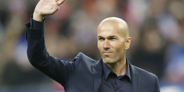 Former France's soccer player Zinedine Zidane waves to spectators prior to the international friendly soccer match between France and Brazil at the Stade de France, north of Paris, France, Thursday, March 26, 2015. Brazil won against France 3-1. (AP Photo/Michel Euler)