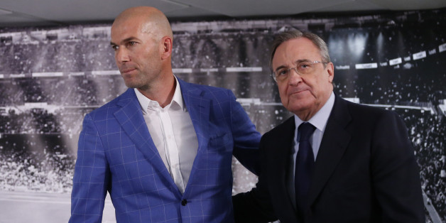 Real Madrid's President Florentino Perez, right, stands with newly appointed coach Zinedine Zidane at the Santiago Bernabeu stadium in Madrid, Spain, Monday Jan. 4, 2016. Real Madrid has fired coach Rafael Benitez after seven months and replaced him with former player Zinedine Zidane a day after Madrid's 2-2 draw at Valencia deepened a crisis that started with an embarrassing 4-0 home loss to rival Barcelona in November. (AP Photo)