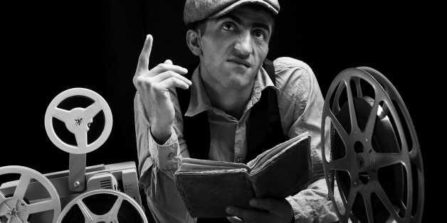 Actor reading the screenplay and making a face while practicing.