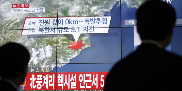 People walk by a screen showing the news reporting about an earthquake near North Korea's nuclear facility, in Seoul, South Korea, Wednesday, Jan. 6, 2016. South Korean officials detected an "artificial earthquake" near North Korea's main nuclear test site Wednesday, a strong indication that nuclear-armed Pyongyang had conducted its fourth atomic test. North Korea said it planned an "important announcement" later Wednesday. The letter read "5.1 Earthquake near North Korea's nuclear facility." (AP Photo/Lee Jin-man)