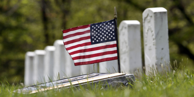 ADVANCE FOR MONDAY MAY 28 AND THEREAFTER - In a Friday, April 27, 2012 photo, a flag and marker are with grave stones for soldiers who died in action or after the Civil War at Albany Rural Cemetery in Menands, N.Y. Nearly 150 years after the last fusillade of the Civil War, historians, authors and museum curators are still finding new topics to explore as the nation commemorates the sesquicentennial of Americaâs bloodiest conflict. Even the long-accepted death toll of 620,000, cited by historians since 1900, is being reconsidered. In a study published late last year in Civil War History, Binghamton University history demographics professor J. David Hacker said the toll is actually closer to 750,000. (AP Photo/Mike Groll)
