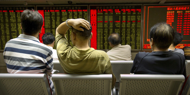 Chinese investors monitor stock prices at a brokerage house in Beijing, Tuesday, Aug. 18, 2015. The Shanghai Composite Index fell 6.2 percent on Tuesday as investors resumed sell-offs of Chinese stocks despite the stabilization of the Chinese yuan. (AP Photo/Mark Schiefelbein)