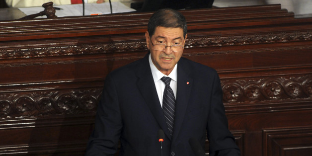 Tunisia's prime minister Habib Essid adresses the parliament in Tunis, Wednesday, July 8, 2015. ays that authorities believe plots aimed at massive deaths and destruction of the country's economy are in the works, and justify the state of emergency declared after a second deadly attack on tourists in three months. (AP Photo/Hassene Dridi)