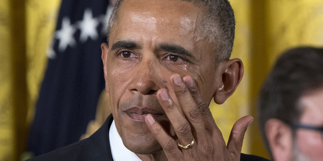 President Barack Obama wipes away tears from his eyes as he speaks in the East Room of the White House in Washington, Tuesday, Jan. 5, 2016, about steps his administration is taking to reduce gun violence. Also on stage are stakeholders, and individuals whose lives have been impacted by the gun violence. (AP Photo/Carolyn Kaster)