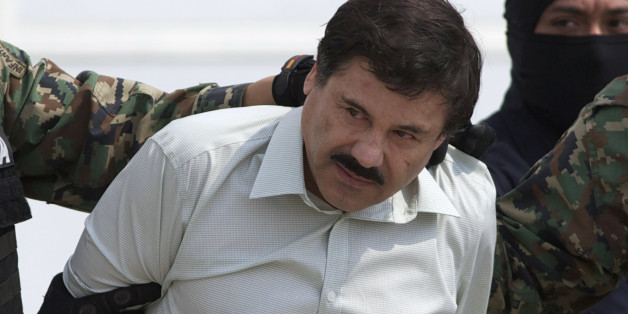 FILE - This Feb. 22, 2014 file photo shows Joaquin "El Chapo" Guzman, the head of Mexicoâs Sinaloa Cartel, being escorted to a helicopter in Mexico City following his capture overnight in the beach resort town of Mazatlan. A judge in Mexico has issued a second arrest warrant to detain escaped drug lord Joaquin "El Chapo" Guzman based on an extradition request from the United States. The federal prosecutorsâ office said Wednesday, Sept. 23, 2015 the new warrant is for U.S. charges of or