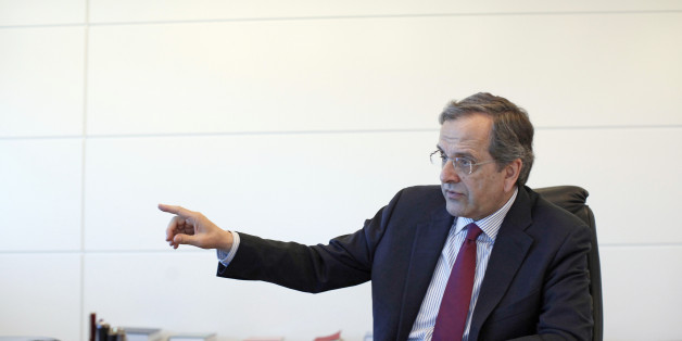 Antonis Samaras, former Greek prime minister and leader of the New Democracy party, gestures whilst speaking during an interview at his party headquarters in Athens, Greece, on Wednesday, April 1, 2015. Europe's most-indebted state is locked in negotiations with euro-area countries and the International Monetary Fund over the terms of its 240 billion-euro ($260 billion) rescue. Photographer: Kostas Tsironis/Bloomberg via Getty Images