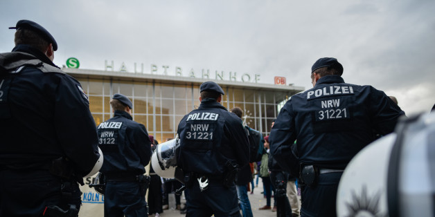 COLOGNE, GERMANY - JANUARY 06: Police stand guard as supporters of Pro NRW, a right-wing, populist group that has campaigned against the construction of new mosques in the German state of North Rhine-Westphalia, protest following the New Year's Eve sex attacks by what witnesses described were gangs of Arab or North African men on January 6, 2015 in Cologne, Germany. So far 90 women have filed charges with police, claiming that they were brutally groped, some were robbed and one even raped by gangs of drunken Arab or North African men at Cologne's Hauptbahnhof main railway station on New Year's Eve. The incident has caused an uproar in Germany and police reported today they have made three arrests. Right-wing groups have responded with furore over the attacks, claiming they are a result of Germany's open-door refugee policy. Police however claim they have no evidence yet to show the attackers were refugees. (Photo by Sascha Schuermann/Getty Images)