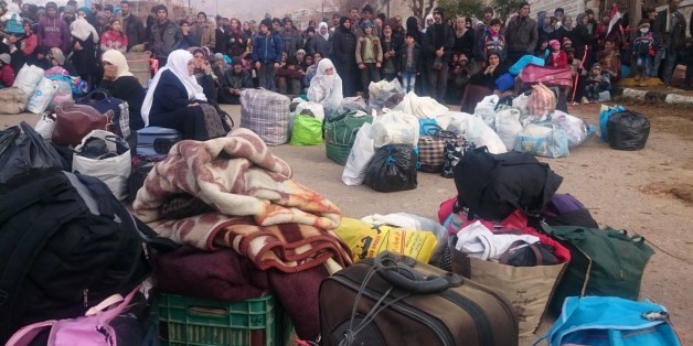 Syrians wait for the arrival of an aid convoy on January 11, 2016 in the besieged town of Madaya as part of a landmark six-month deal reached in September for an end to hostilities in those areas in exchange for humanitarian assistance.
Forty-four trucks operated by the International Committee of the Red Cross, the Syrian Red Crescent, the United Nations and World Food Programme left from Damascus to enter Madaya, where more than two dozen people are reported to have starved to death.
/ AFP / Marwan IBRAHIM (Photo credit should read MARWAN IBRAHIM/AFP/Getty Images)
