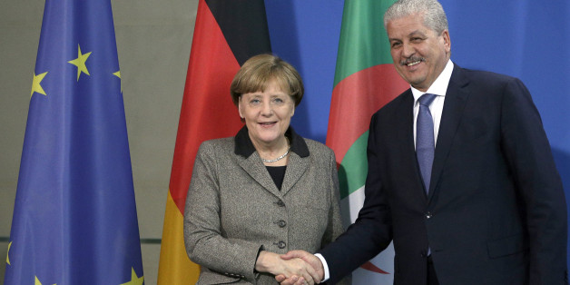 German Chancellor Angela Merkel, left, and the Prime Minister of Algeria Abdelmalek Sellal, right, shake hands after a joint press conference as part of a meeting at the chancellery in Berlin, Germany, Tuesday, Jan. 12, 2016. (AP Photo/Michael Sohn)