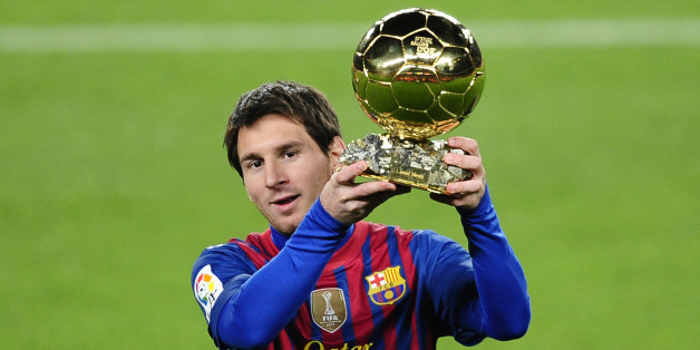 FC Barcelona's Lionel Messi, from Argentina, holds his Ballon d'Or (Golden Ball) award as European Footballer of the Year before a Spanish La Liga soccer match between FC Barcelona and Betis at the Camp Nou stadium in Barcelona, Spain, Sunday, Jan. 15, 2012. (AP Photo/Manu Fernandez)