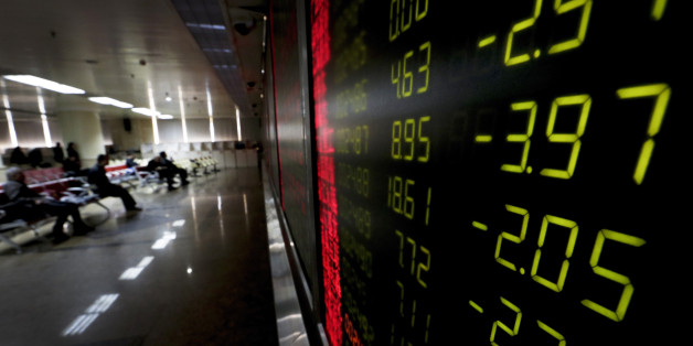 An electronic board display stock prices at a brokerage house in Beijing, Thursday, Jan. 14, 2016. Asian stock markets sank across the board Thursday as pessimistic sentiment following sustained weakness in oil prices and a dive on Wall Street prevailed over data showing economies on the mend. (AP Photo/Andy Wong)