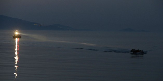 A Greek coast guard vessel uses its light to give directions at a dinghy overcrowded with Syrian migrants in Mytilene, on the northeastern Greek island of Lesvos, early Tuesday, June 16, 2015. Lesvos has been bearing the brunt of a huge influx of migrants from the Middle East, Asia and Africa crossing from the Turkish coast to nearby Greek islands. More than 50,000 migrants have arrived in Greece already this year, compared to 6,500 in the first five months of last year. (AP Photo/Thanassis Stavrakis)