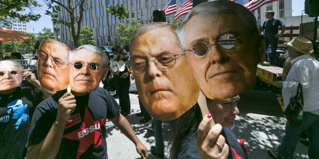 Members of the "Save Our News'' coalition, including: Courage Campaign, SEIU, Forecast the Facts, Greenpeace and the Los Angeles Federation of Labor, rally before delivering a 500,000-signature petition urging the Tribune Co. management to reject any offers by the Koch Brothers to buy The Los Angeles Times newspaper outside the newspaper headquarters in Los Angeles Wednesday, May 29, 2013. Brothers Charles and Bill Koch have donated millions to several conservative causes. (AP Photo/Damian Dovar