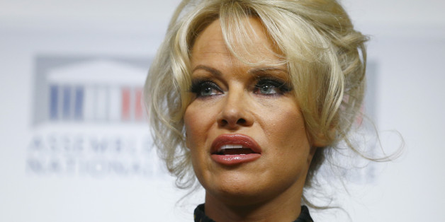 Pamela Anderson, actress and animals rights defender, delivers her speech during a news conference at the French National Assembly to protest the force-feeding of geese used in the production of foie gras, in Paris, France, Tuesday, Jan. 19, 2016. (AP Photo/Francois Mori)