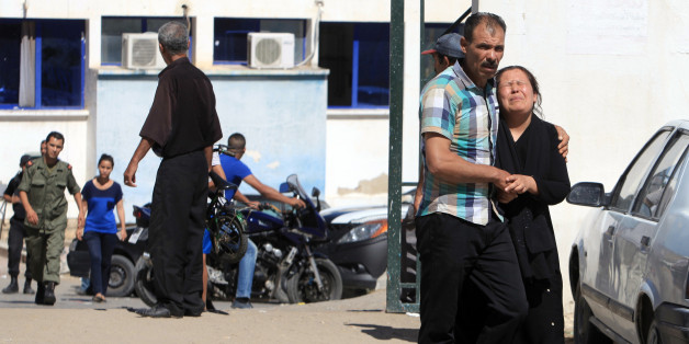 - FILE - In this July 17, 2014 file photo, a relative of a victim, right, cries outside the hospital of Kasserine, near the Algerian border, after militants in western Tunisia staged two simultaneous attacks on army posts while soldiers held a Ramadan feast. The country that kicked off the Arab Spring by overthrowing its dictator in 2011, Tunisia is also the only place where the transition to democracy is on track, even as it battles armed militants, a struggling economy and a deeply divided political class. Voters will head to the ballots on October 26, exactly three years after they put into power a moderate Islamist party. (AP Photo/ Mouldi Kraeim, File)