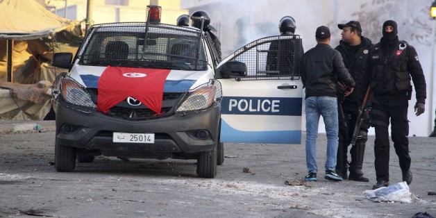 Police forces gather in the city of Ennour, near Kasserine, Tunisia, Wednesday, Jan. 20, 2016. Tunisia has declared a curfew in the western city after clashes between police and more than 1,000 young protesters demonstrating for jobs. Tensions have risen in Kasserine since Sunday when an unemployed youth killed himself by scaling an electricity transmission tower to protest his rejection for a government job. (AP Photo/Moncef Tajouri)