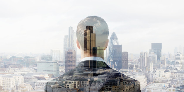 Double exposure of a business man looking towards the financial district of the City of London with the Heron Tower, Tower 42 and the Gherkin.