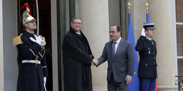 French President Francois Hollande, right, greets Tunisian Prime Minister Habib Essid before a meeting at the Elysee Palace, in Paris, Friday, Jan. 22, 2016. (AP Photo/Christophe Ena)