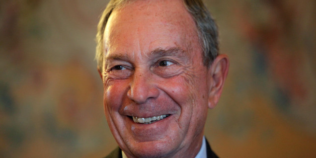 FILE - In this Sept. 16, 2014, file photo, former New York Mayor Michael Bloomberg smiles prior to be conferred with the Chevalier de la Legion d'Honneur by France's Foreign minister Laurent Fabius, at the Quai d'Orsay, in Paris. A Department of Investigation probe is finding that New York Cityâs effort to modernize its 911 system is years behind schedule and $700 million over budget. The probe released Friday, Feb. 6, 2015, lays the blame at the feet of the former mayor's administration. (