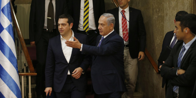 Israel's Prime Minister Benjamin Netanyahu and Greece's Prime Minister Alexis Tsipras, arrive for a press conference, in Jerusalem, Wednesday, Nov. 25, 2015. (Ronen Zvulun/Pool Photo via AP)