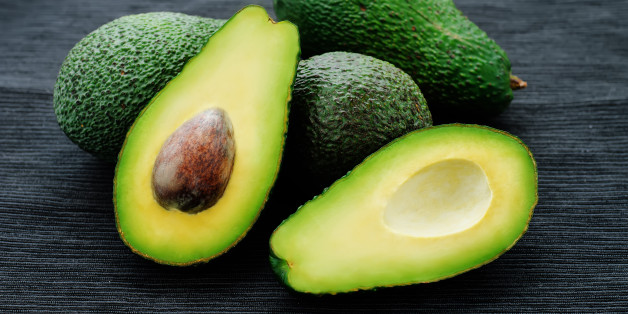 avocado on a black background. tinting. selective focus