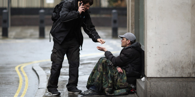 LONDON, ENGLAND - JANUARY 27: Wayne, 35 (no surname given) asks passers by for money near Westminster on January 27, 2016 in London, England. A group of 21 charities, including Crisis, St Mungos and Centrepoint, have called for extra effort by the next London Mayor to help end the growing problem of homelessness on Londons streets. (Photo by Dan Kitwood/Getty Images)
